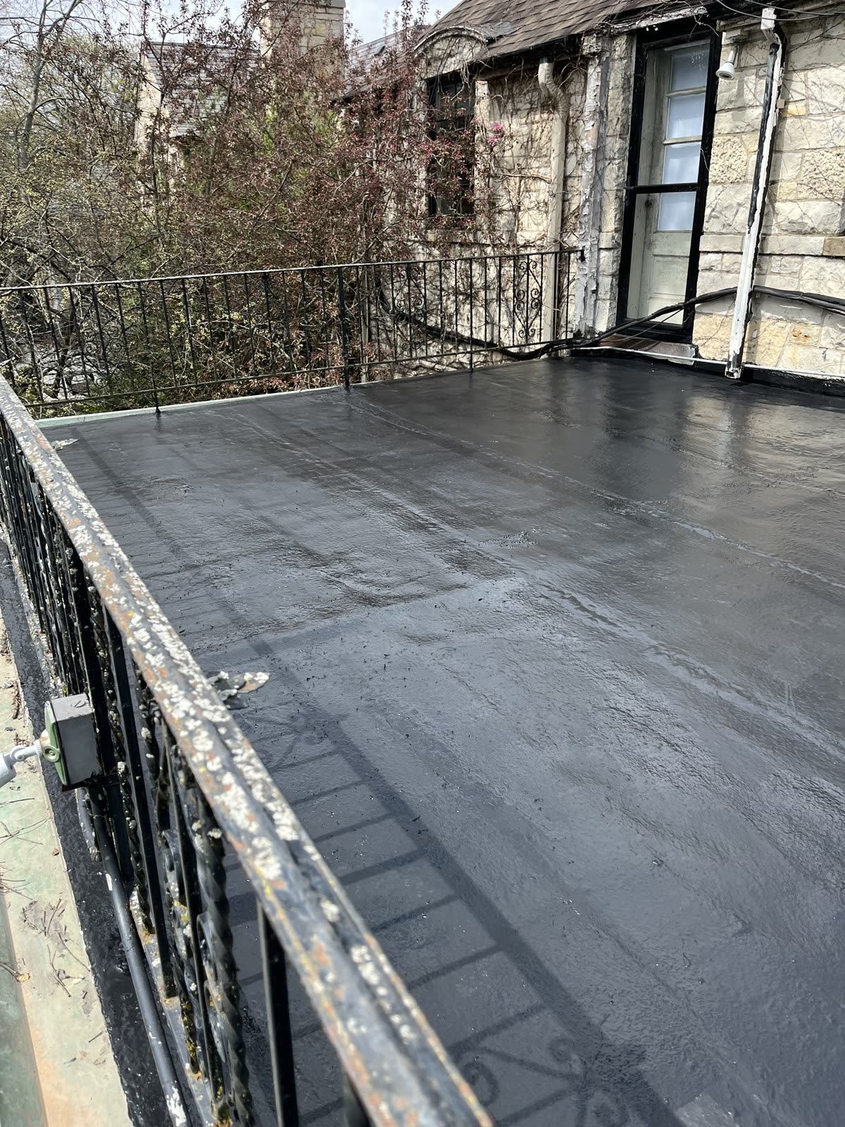 Completed Gaco Silicone Roof Coating on narrow section of Winnetka balcony roof