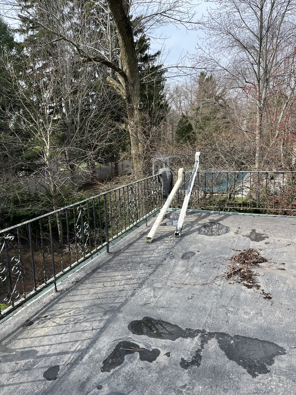 Standing water on Winnetka balcony flat roof before repair